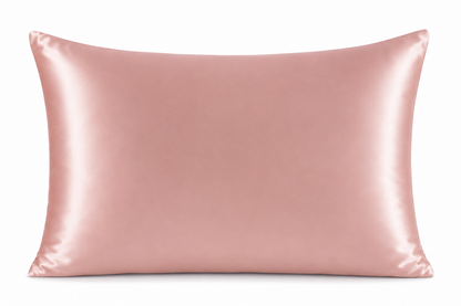 Pink satin pillow on a white background